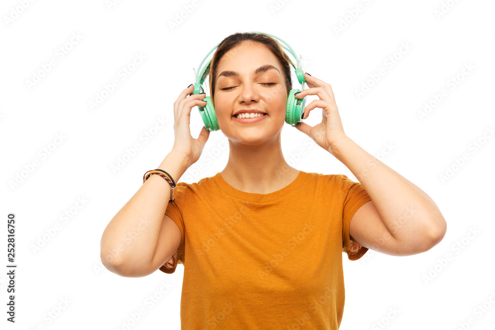 music, technology and people concept - happy young woman or teenage girl with headphones music, technology and people concept - happy young woman or teenage girl with headphones