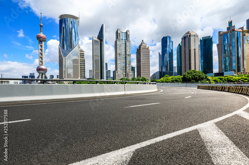 Asphalt road passes through Shanghai Lujiazui Financial District