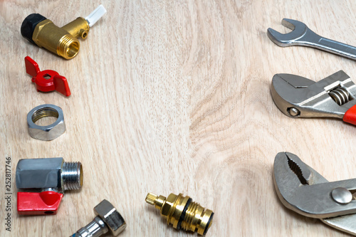 Plumbing tools and spare parts on the table.