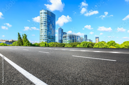Empty asphalt road and modern commercial buildings in Shanghai © ABCDstock