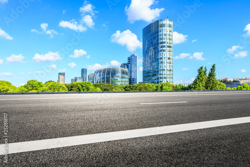 Empty asphalt road and modern commercial buildings in Shanghai © ABCDstock