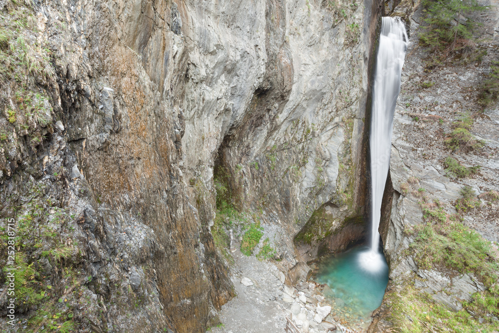 small waterfall and lake among the rocks