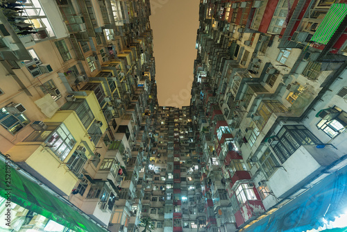 Crowded Old residential building in Hong Kong city at night
