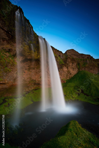 Fototapeta Naklejka Na Ścianę i Meble -  The Seljalandsfoss waterfall in the last golden light. One of the most famous waterfalls in Iceland.