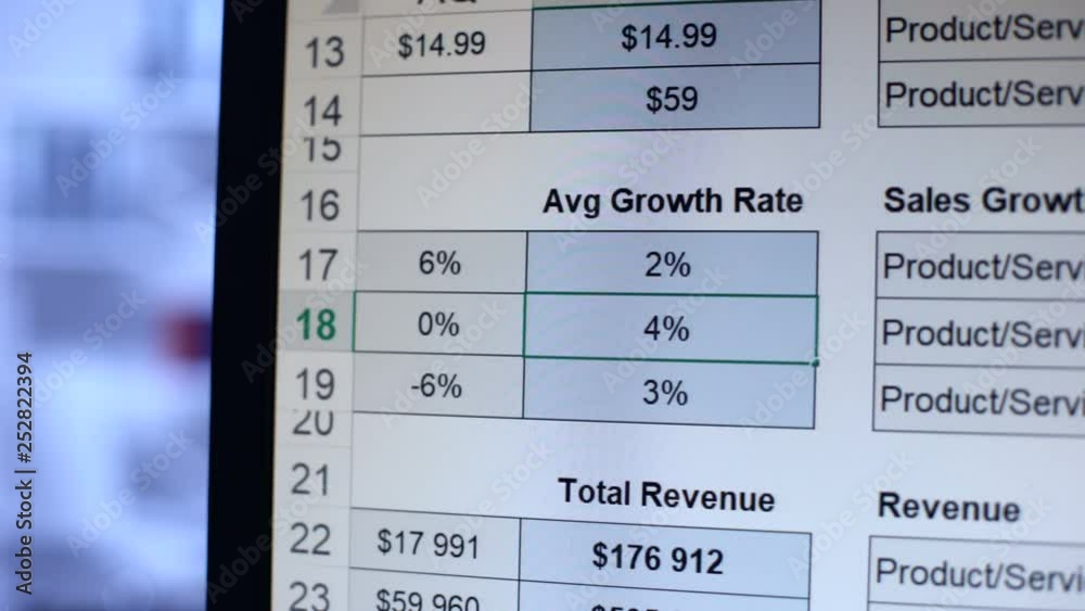 Person writing numbers to average growth rate table, calculation, bookkeeping Person writing numbers to average growth rate table, calculation, bookkeeping