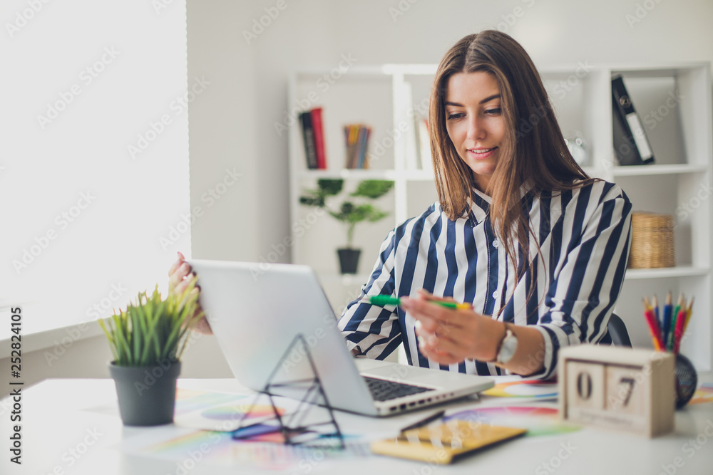 Young perspective web designer and blogger in modern office
