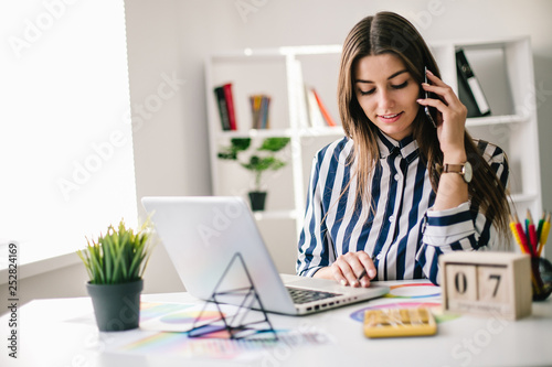 Young perspective web designer and blogger in modern office