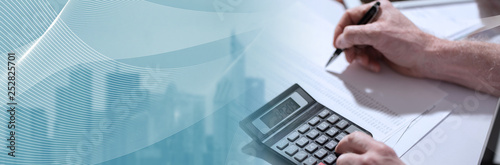 Hand using calculator, accounting concept. panoramic banner