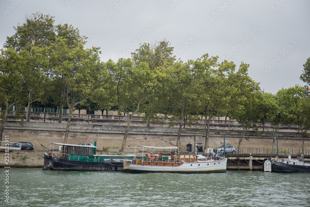 boats on the pier near the river Seine in paris