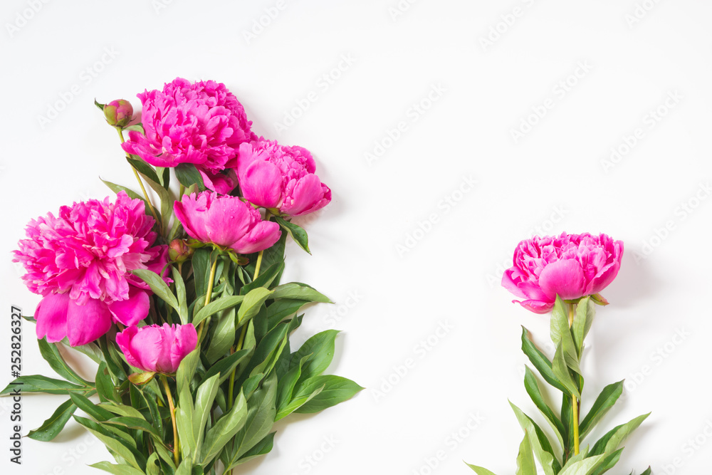 Fototapeta premium Bouquet of romantic pink peony flowers on white. Copy space. Top view.