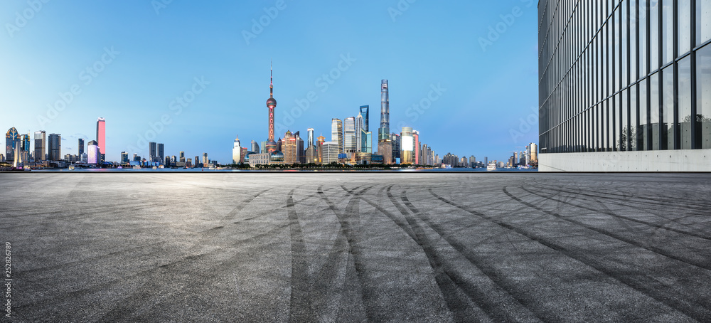 Empty asphalt square ground with panoramic city skyline in Shanghai,China Empty asphalt square ground with panoramic city skyline in Shanghai,China