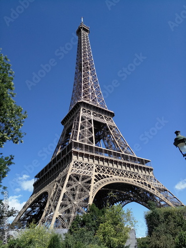 Eiffel Tower on a background of blue sky in Paris