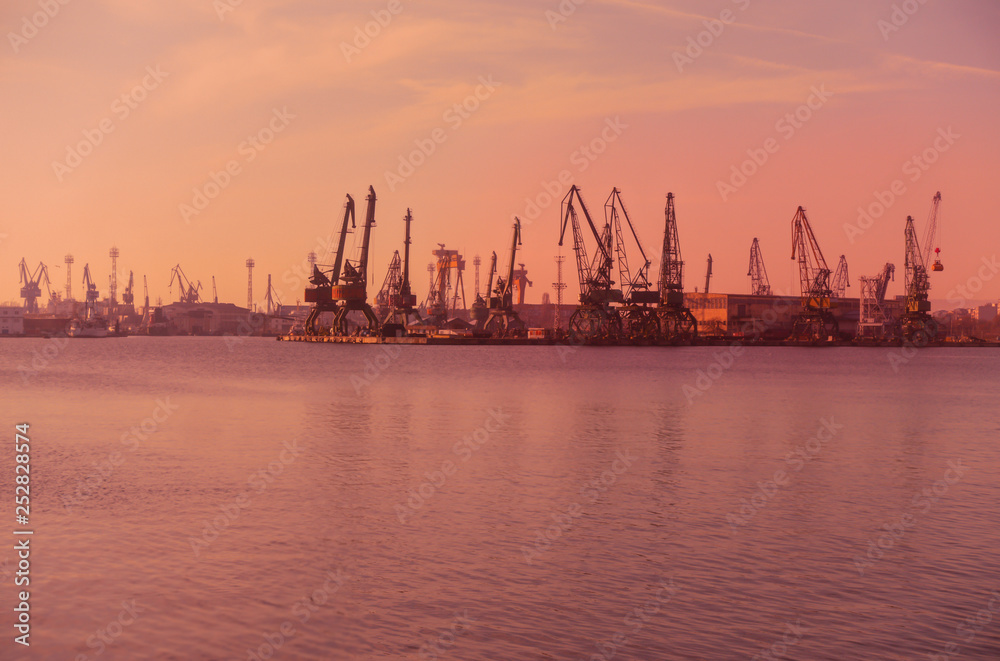 Harbor cranes sunset seascape