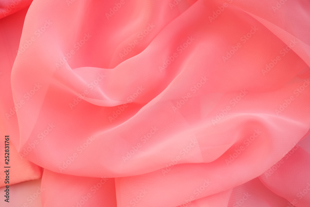 Pink georgette fabrics. The purple texture of the pleated fabric... Pink georgette fabrics. The purple texture of the pleated fabric...