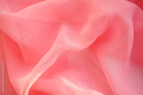Pink georgette fabrics. The purple texture of the pleated fabric..