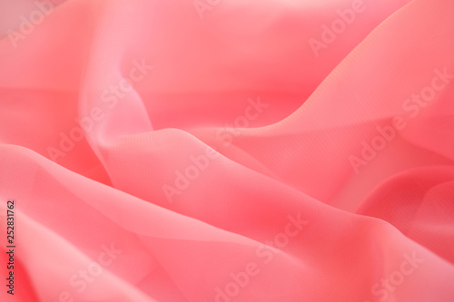 Pink georgette fabrics. The purple texture of the pleated fabric..