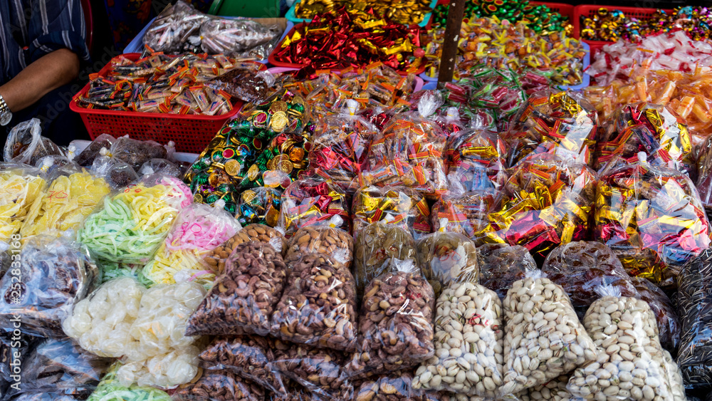 Fototapeta premium Assartements of asian candies in the vietnamese market .different kinds of sweets in the local market