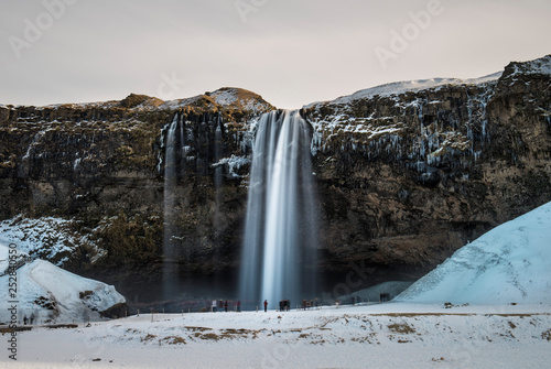Seljalandsfoss waterfall in winter in long exposure