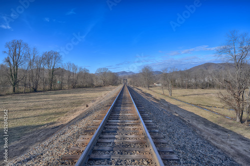 "The Ridge Runners" railfoad tracks running west towards the Blue Ridge Mountains Zen Duder on the Road Collection