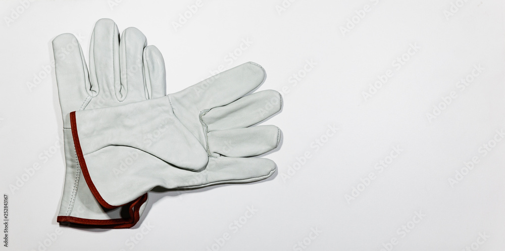 Obraz premium Pair of white glove on white wooden plank, DIY Concept.
