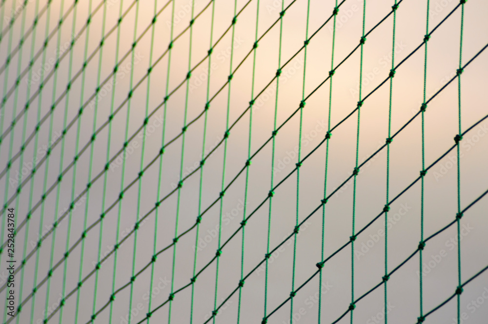 Green mesh with sky background Green mesh with sky background