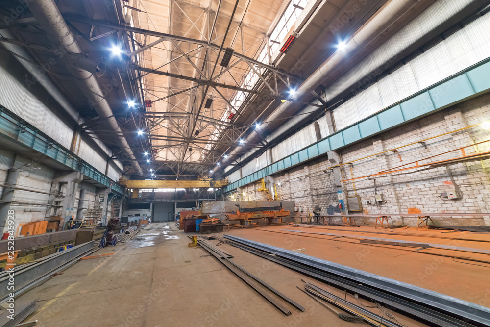 Industrial concept. An overview on construction site inside the manufacturing plate. Details for future construction Industrial concept. An overview on construction site inside the manufacturing plate. Details for future construction