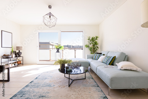 Fotografia Modern living room with designer sofa and coffee table