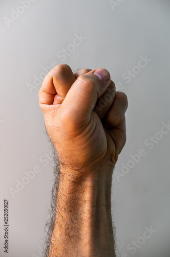 Clenched fist over white background © Rafael