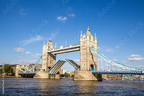 View of Tower Bridge on the River Thames opening for passing boats