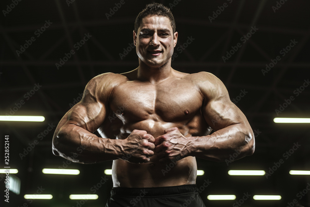 Handsome strong athletic men pumping up muscles workout bodybuilding concept background Handsome strong athletic men pumping up muscles workout bodybuilding concept background