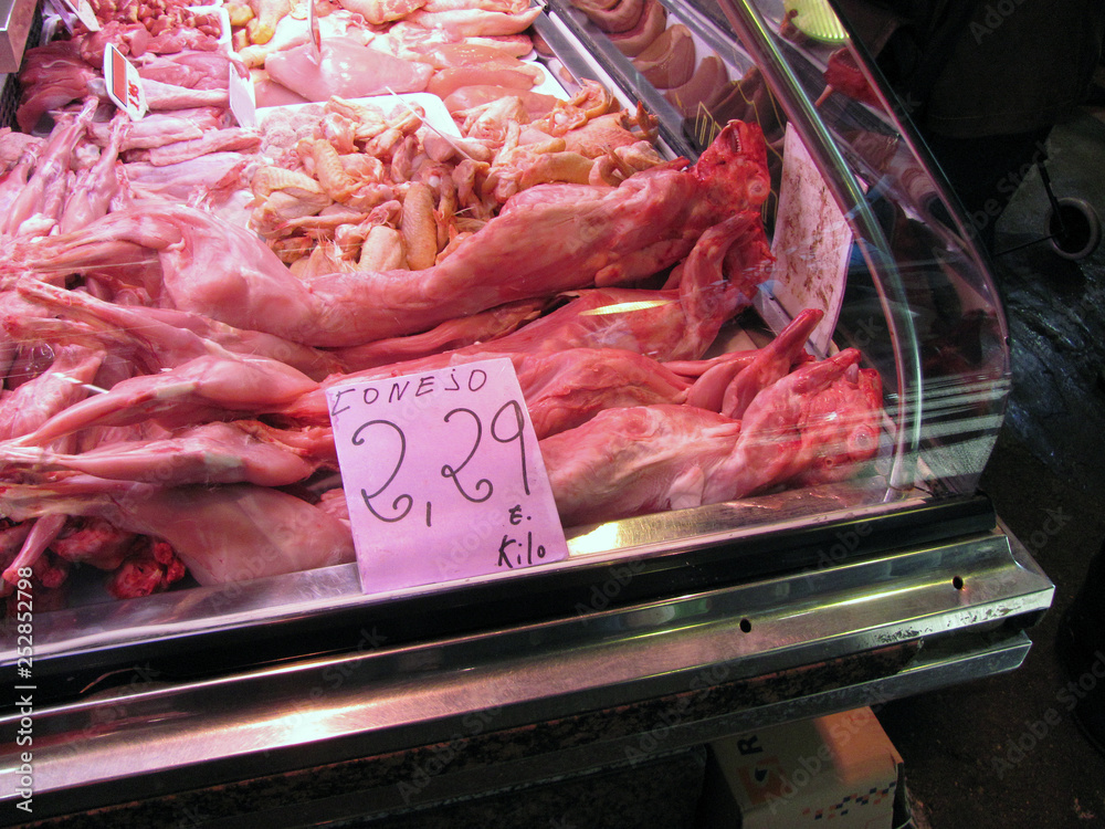 Rabbit meat at the market. Sign with Spanish text conejo (rabbit).