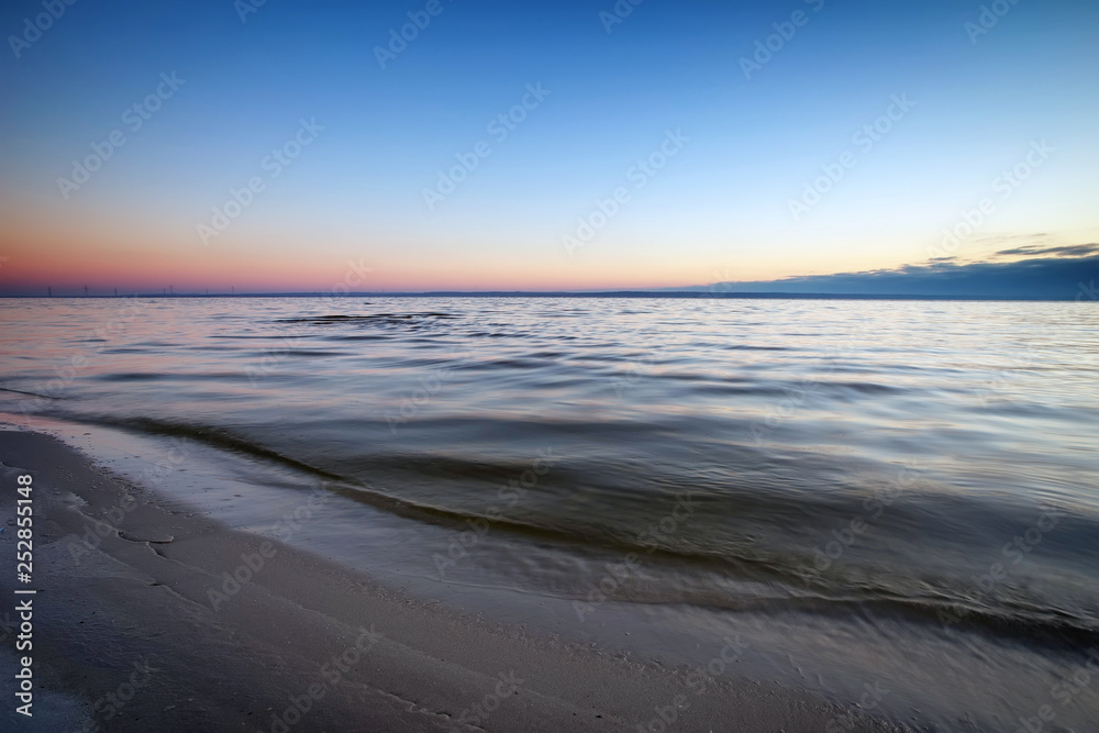 Seascape with blue sky and sea. Beach at dawn