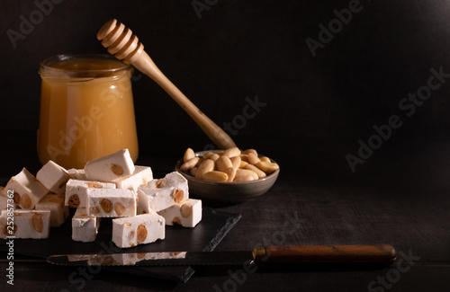 Homemade nougat with honey and almonds. photo