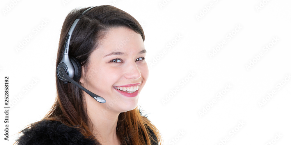 attractive and happy young woman with headset on her head attractive and happy young woman with headset on her head