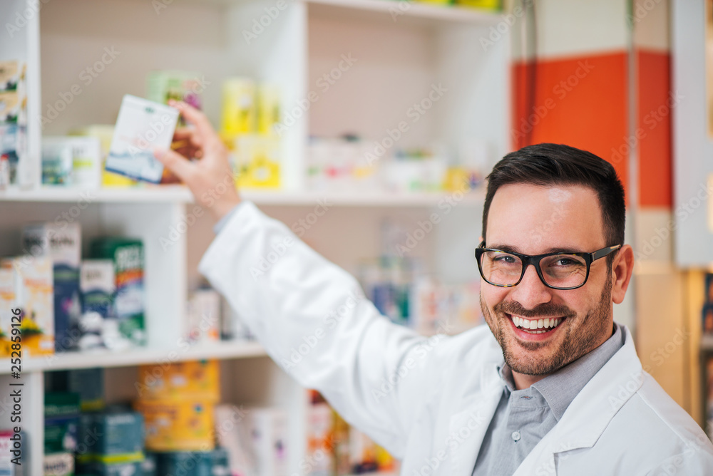 Portrait of a handsome pharmacist at work.