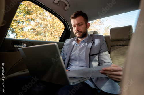 Man analyzing business data from his computer © didesign