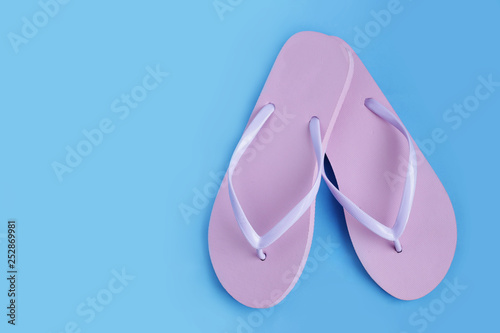 Flip flops on blue background