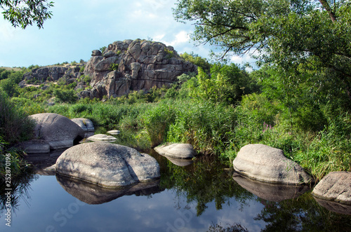 Beautiful view of the river with stone boulders