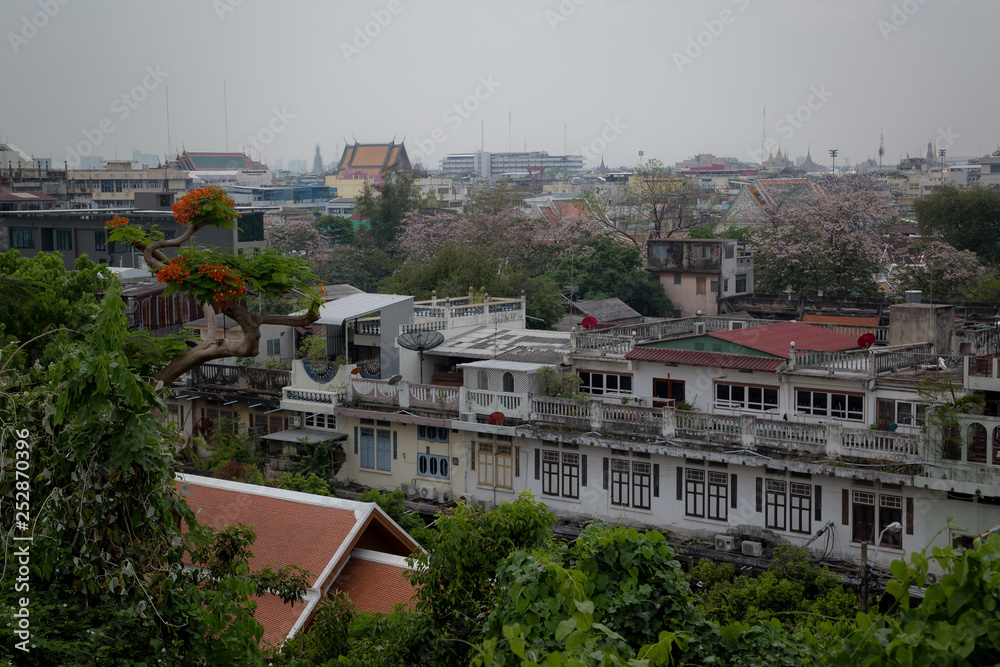 Fototapeta premium The view of Bangkok city during daylight from Golden mountain temple top.