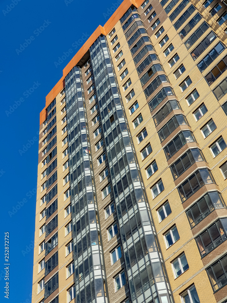 Fototapeta premium Multistory building. Apartments in the house. Facade.