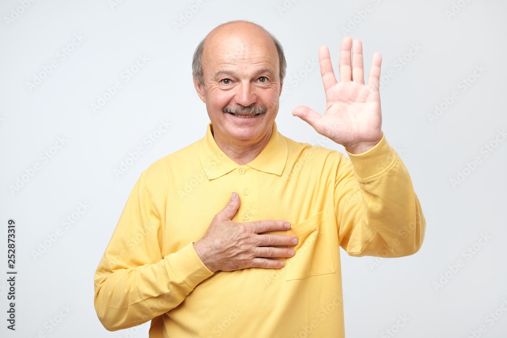 senior man raising palm and holding hand on chest, promising to me honest senior man raising palm and holding hand on chest, promising to me honest