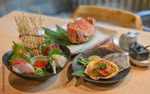 Mixed sliced fish sashimi on ice in bowl
