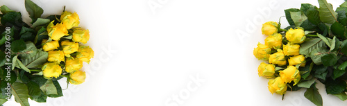 bouquet fresh yellow roses flowers with leaves white background. Flat lay, top view. corner frame composition. postcard birthday celebration father's day, mother's day, birthday floral arrangement