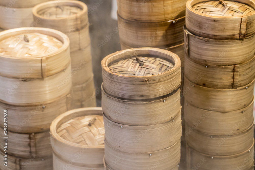 Steamed dim sum bamboo trays by Local street food vendors in Singapore Steamed dim sum bamboo trays by Local street food vendors in Singapore