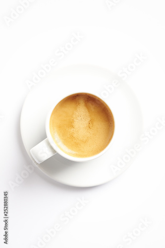 Cup of coffee isolated on white background. Top view. Copy space.