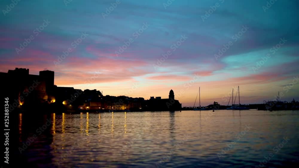 Beautiful small bay with old church of Our Lady of the Angels in the Collioure at late evening, France. Beautiful small bay with old church of Our Lady of the Angels in the Collioure at late evening, France.