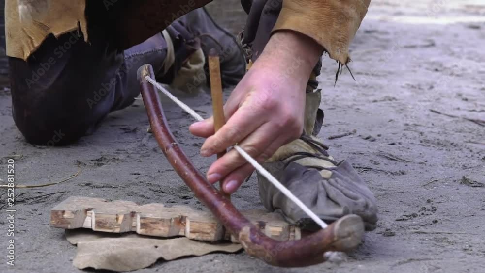 Primitive fire starting with a bow drill (fire drill) clip Primitive fire starting with a bow drill (fire drill) clip
