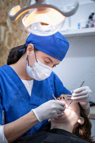 female dentist working on a patient