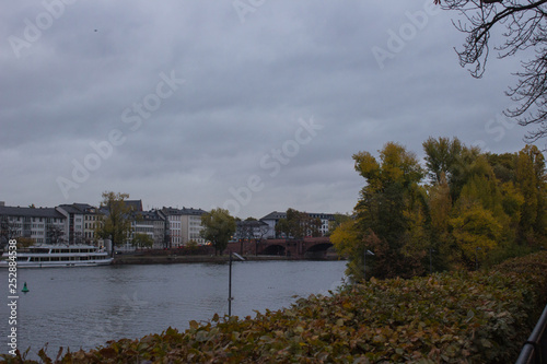 View from the embankment on the Main River, the bridge and the city of Frankfurt