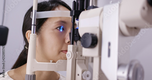 Woman check on eye in clinic